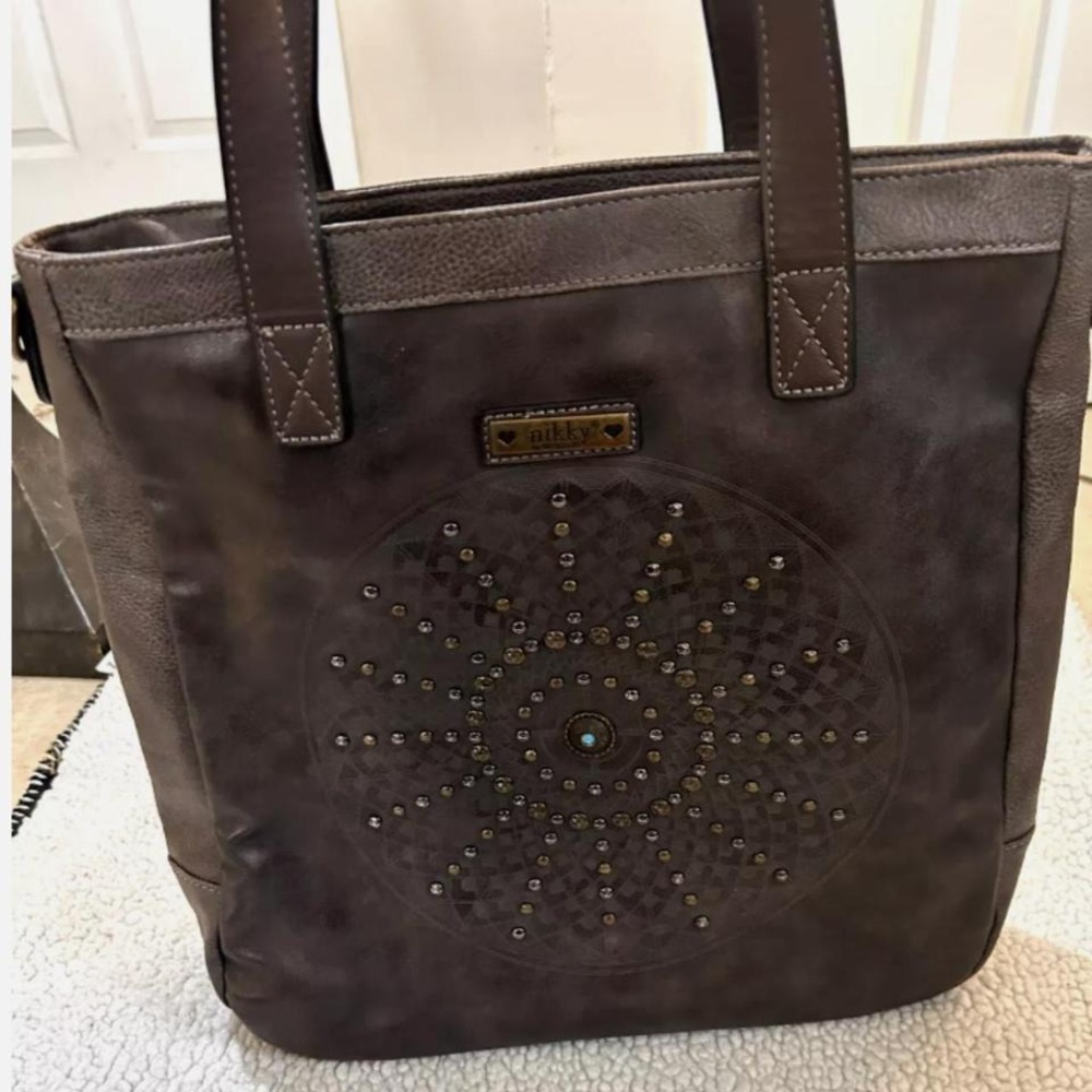 Elevate your accessory game with the Nikky by Nicole Lee Studded Tote